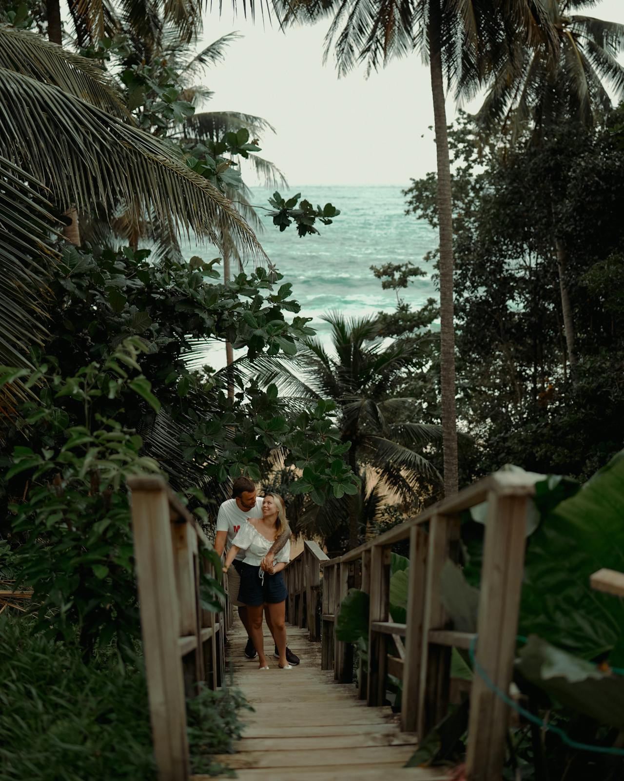 Tourists standing on the wooden Bridge in the Central of Thailand
